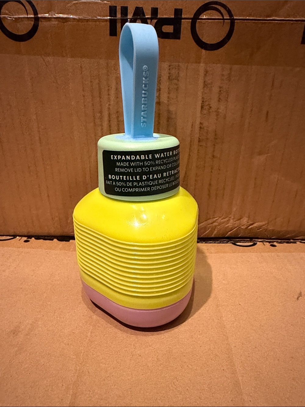 Starbucks Yellow Expandable Water Bottle with Pastel Blue Strap and Pink Base